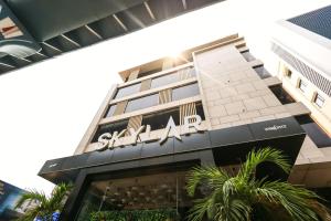 a building with a sign on the side of it at SKYLAR Tirupati in Tirupati