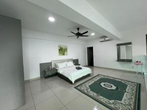 a bedroom with a bed and a ceiling fan at Kita Retail Management Sdn Bhd in Bandar Baru Bangi