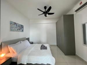 a bedroom with a bed with a ceiling fan at Kita Retail Management Sdn Bhd in Bandar Baru Bangi