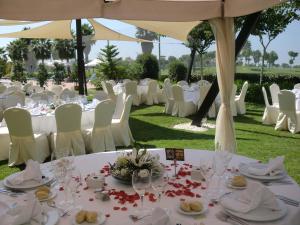 a table set up for a wedding with white tables and chairs at Barceló Costa Ballena Golf & Spa in Costa Ballena +106 photos