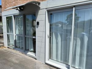 a window on the side of a building at 2 Bedroom Unit in Howick in Auckland
