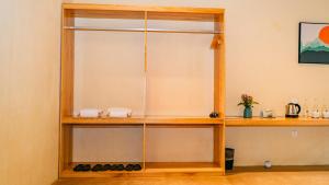 a wooden shelf with some items on it at Vả Riverside Retreat in Hue