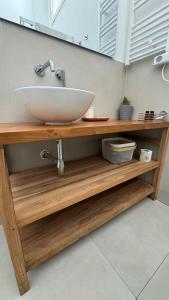 a bathroom counter with a sink and a mirror at Idumea Rooms in Lecce