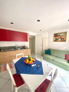 a living room with a table with a bowl of fruit on it at FRANCESCA'S HOUSE in Minori