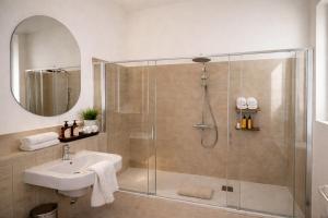 a bathroom with a shower and a sink at R Oleandro House in Como +19 photos