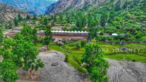 an aerial view of a train in a mountain valley at Jispa Journey Camp Lahoul & Spiti in Manāli