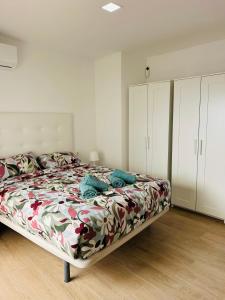 a bedroom with a bed and white cabinets at Casa Privada Benidorm Centro in Benidorm