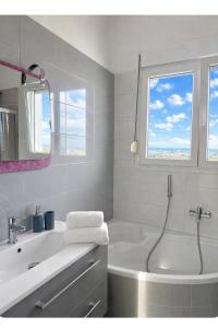 a white bathroom with a tub and a sink at Sunrise Villa in Kassandra +92 photos