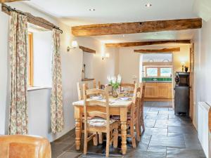a kitchen and dining room with a table and chairs at 3 Bed in Winkleigh oc-1450b in Iddesleigh