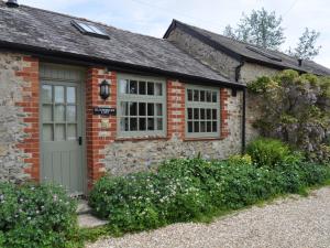 a brick house with a door and windows at 2 Bed in Axminster oc-blolo in Axminster
