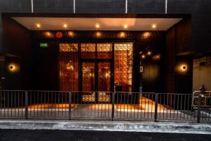 a building with a door with lights on it at Oootopia West in Hong Kong