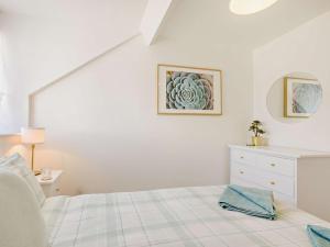 a white bedroom with a bed and a dresser at 2 Bed in Bideford oc-60428 in Westward Ho +15 photos