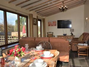 a living room with a couch and a table at 4 Bed in Tiverton oc-60110 in Uplowman