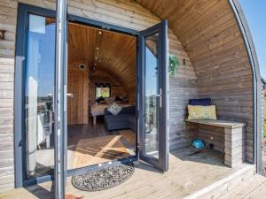 an internal view of a tiny house with sliding glass doors at 1 Bed in Barnstaple oc-90190 in Bratton Fleming +17 photos