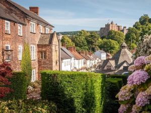a view of a town with buildings and flowers at 1 Bed in Minehead oc-90923 in Minehead