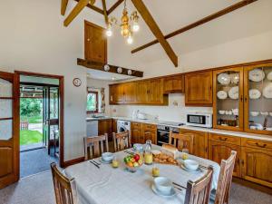 a kitchen with a table with food on it at 3 Bed in Holsworthy oc-tcsheph in Merryfield +14 photos