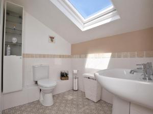 a bathroom with a white toilet and a sink at 2 Bed in Crediton oc-51275 in Stockleigh Pomeroy +25 photos