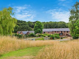 a group of buildings in the middle of a field at 3 Bed in Taunton oc-96235 in West Quantoxhead