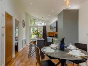 a kitchen and dining room with a table and chairs at 2 Bed in Brixham oc-78565 in Brixham
