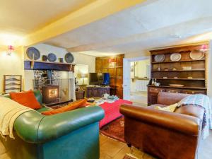 a living room with two couches and a table at 4 Bed in Minehead oc-90504 in Dunster