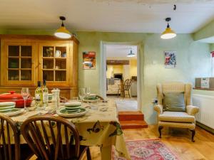 a dining room with a table and chairs at 4 Bed in Minehead oc-90504 in Dunster +19 photos