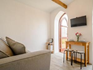 a living room with a couch and a window at 1 Bed in Okehampton oc-78799 in Hatherleigh