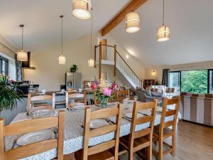 a dining room with a table and chairs at 5 Bed in Dulverton oc-87003 in Morebath