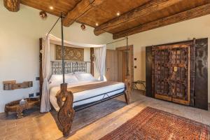 a bedroom with a bed with a swing in it at Tenuta Le Cave in Tregnago +94 photos