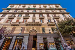 a tall building with a lot of windows at Napoli Suite in Naples