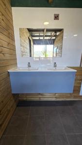 a bathroom with two sinks and a large mirror at CCA area in Hio +61 photos
