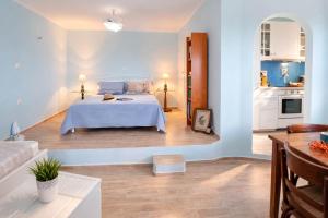 a large bedroom with a bed and a kitchen at Dreamy View in Folegandros in Áno Meriá