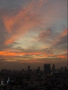 a view of a city skyline at sunset at Condo in Cubao, Sunset & City Lights Chasing in Manila