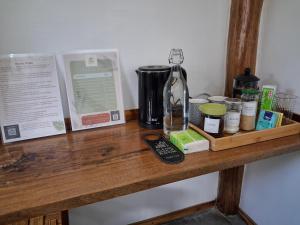 a wooden counter with a coffee maker and other items on it at Sunset Garden in San Vicente