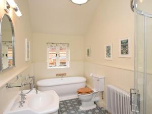 a bathroom with a toilet and a sink at 1 Bed in Stoke Abbott oc-50885 in Stoke Abbott +18 photos