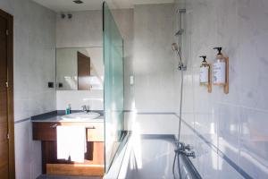 a bathroom with a shower and a sink at Alda Corcubión in Corcubión +62 photos