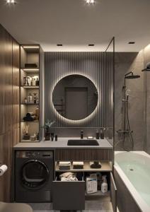 a bathroom with a sink and a tub and a mirror at Amiron Hotel in Dushanbe +13 photos