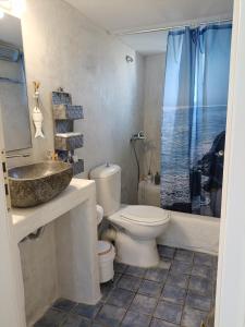 a bathroom with a toilet and a sink and a shower at Molos Sea View House - Paros Greece in Molos Parou +46 photos