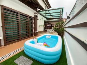 a large inflatable tub sitting on top of a house at Ruma Relaxz by Jeffery Lam Home Management in Malacca