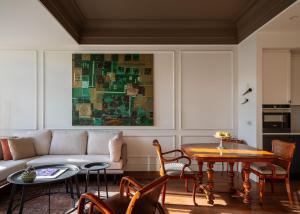 a living room with a couch and a table at Hovagimyan Hotel and Suites in Istanbul +34 photos