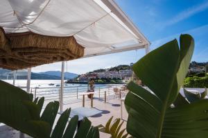 a view of a patio with a view of the water at Alda Corcubión in Corcubión