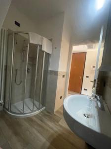a bathroom with a shower and a sink at Villa Aurora Apartments in Sirmione +9 photos