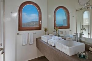 a bathroom with two sinks and two windows at Greco Philia Hotel Boutique by Mr and Mrs White in Elia Beach