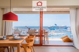 a dining room with a view of the ocean at Horitzó Marí Palamós in Palamós