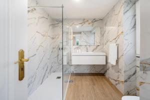 a bathroom with a shower and a sink at Exceptional stone character house Chalet Prazeres in Prazeres +12 photos