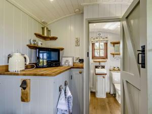a kitchen with a counter top and a sink at 1 Bed in Beaworthy oc-77361 in Ashwater +23 photos