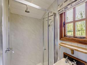 a bathroom with a shower and a sink at 1 Bed in Beaworthy oc-77361 in Ashwater