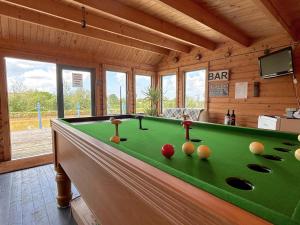 a billiard room with a green pool table at 1 Bed in Beaworthy oc-82834 in Ashwater