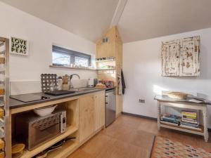 a kitchen with a sink and a counter top at 1 Bed in Okehampton oc-78087 in Hatherleigh