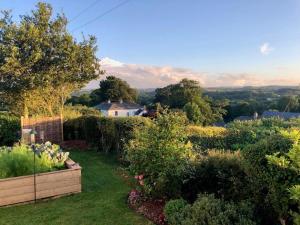 a garden with a view of the countryside at 1 Bed in Okehampton oc-78087 in Hatherleigh +10 photos