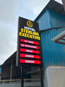 a sign in front of a building at Hotel Sterling Executive in Navi Mumbai